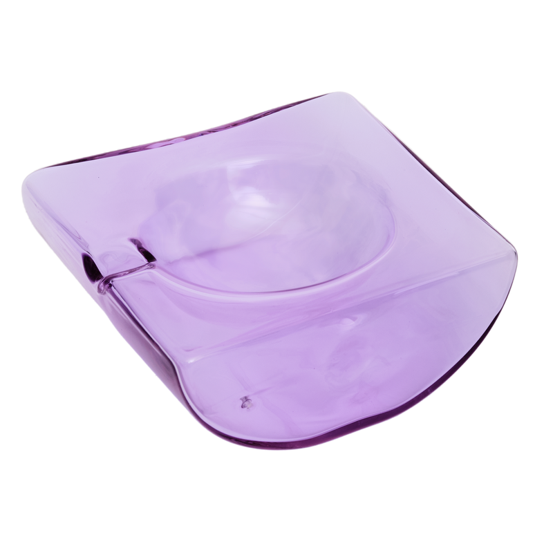Purple glass bowl on a white background